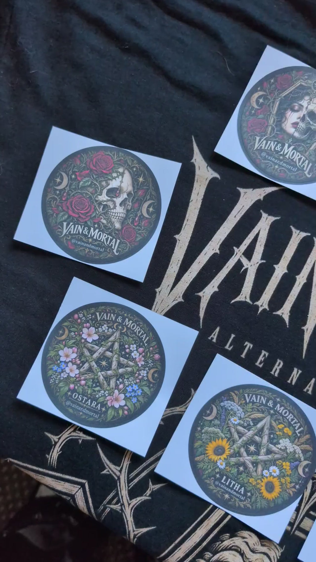 A close-up of the nine VAIN & MORTAL gothic stickers