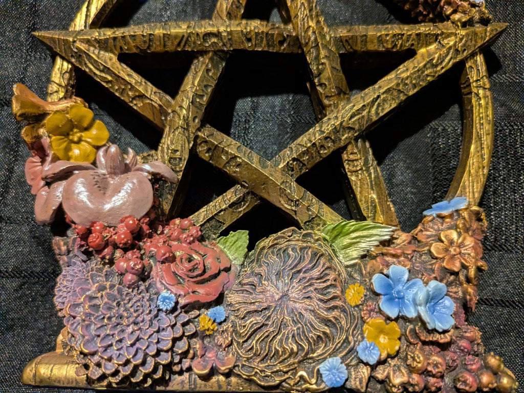 Ostara pentagram floral arrangement with blue and pink flowers