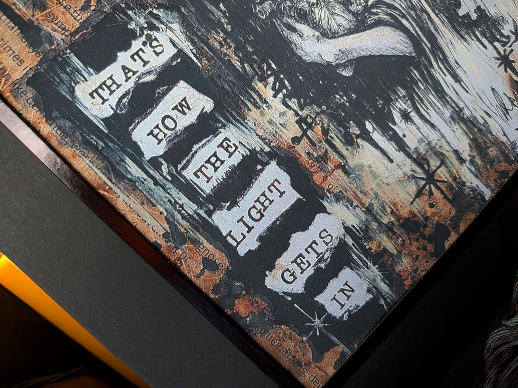 Close-up detail of text on We Are All Broken cotton canvas print